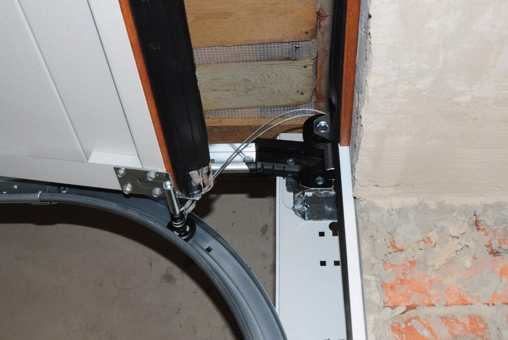 garage door bottom seal track replacement